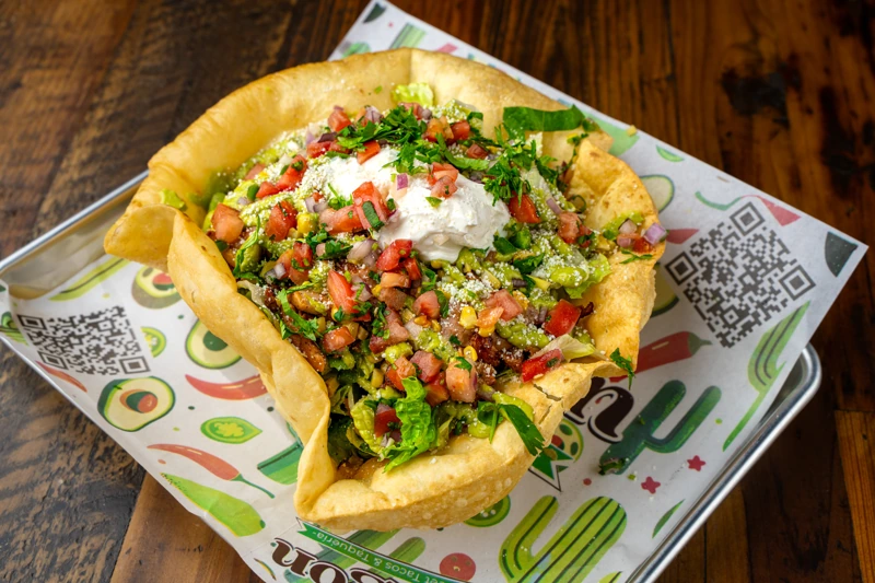 Fresh taco salad with toppings at El Fogón Taquería.