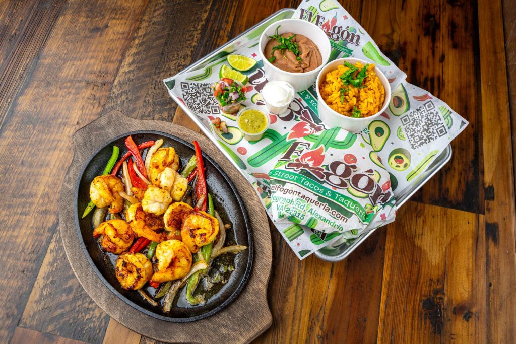 Sizzling shrimp fajitas with vegetables from El Fogón Taquería in Alexandria.