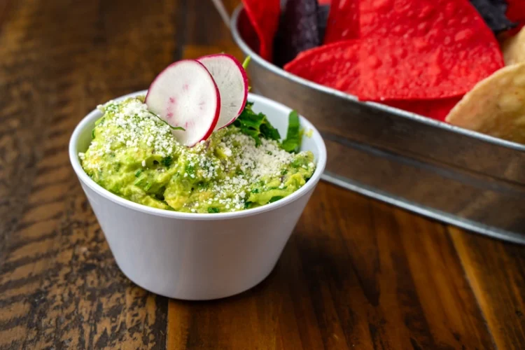 Fresh guacamole made with avocados at El Fogón Taquería, authentic Mexican dip.