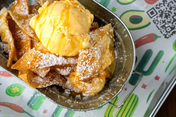 Fluffy fried sopapilla pastry dessert from El Fogón Taquería.