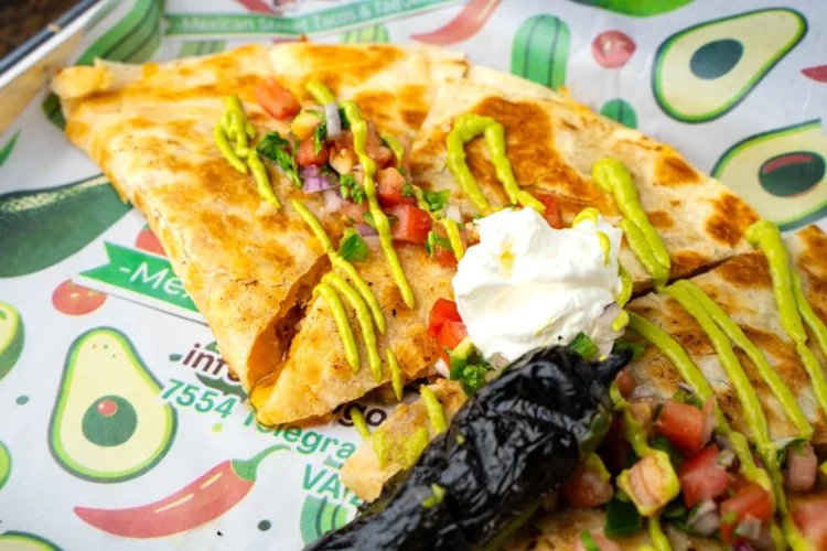 Cheesy quesadilla with meat from El Fogón Taquería's Mexican menu.